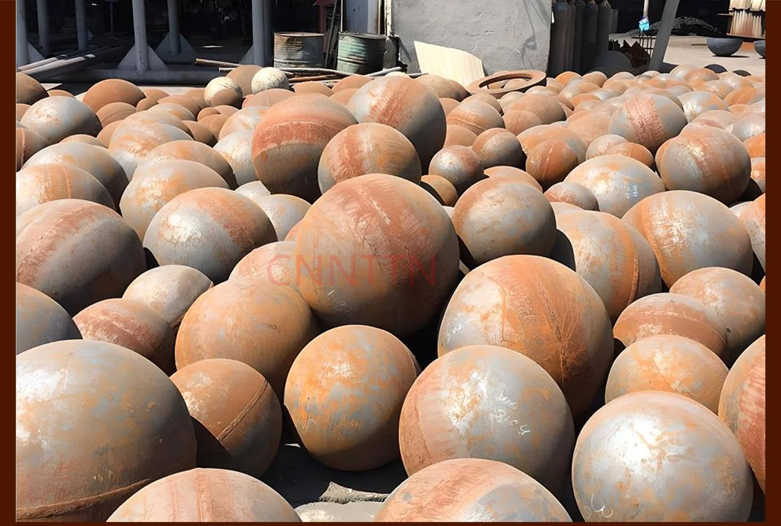 Unmachined spherical blanks shown in storage.