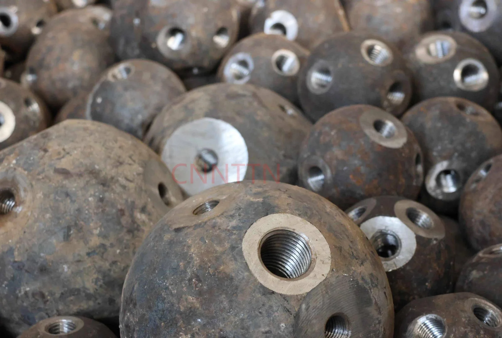 A group of steel ball nodes with machined connection faces.