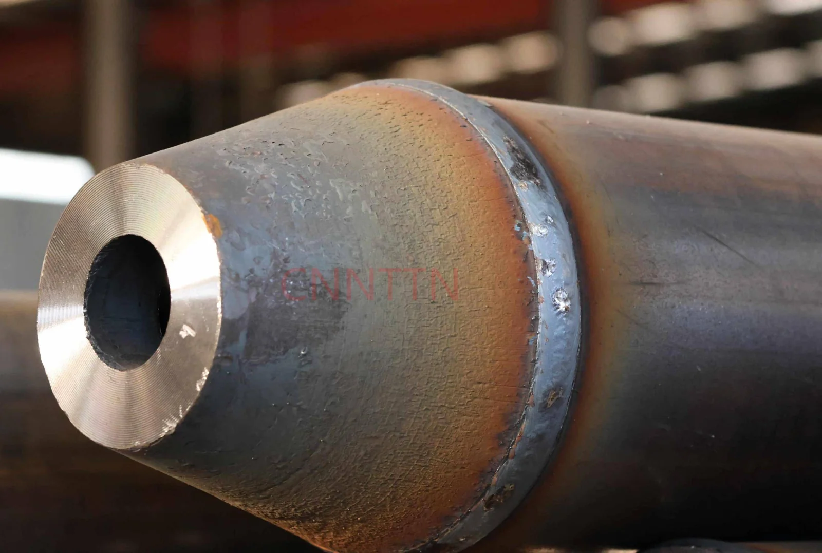 A tapered end component attached to a tubular member.