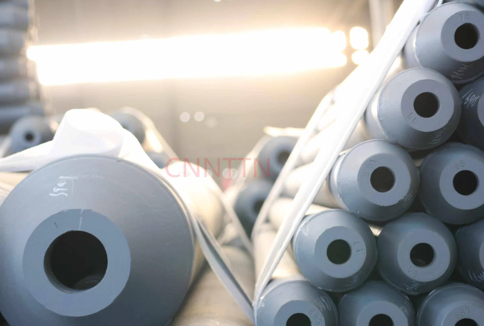 Close view of coated tubular member ends.