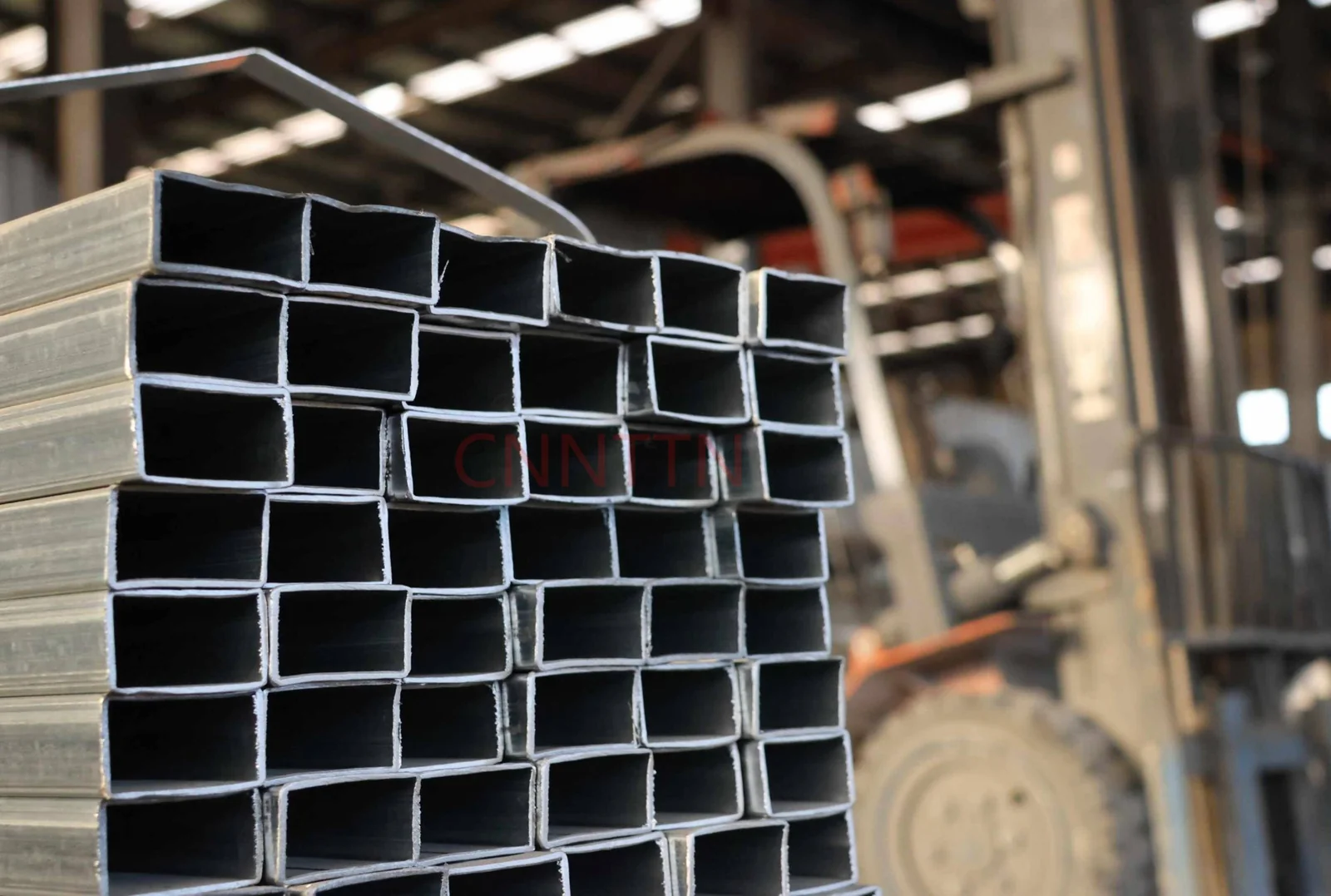 Rectangular steel hollow sections in storage.