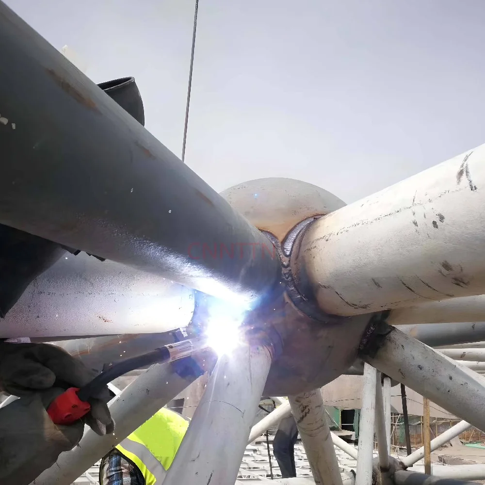 Welding at a tubular connection. Image from the supplied site archive; project identity is not documented here.